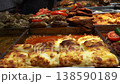 Variety of authentic Turkish food displayed at a traditional lokanta or bistro in Istanbul. Wide selection of ready-to-eat dishes like kebabs, stews, vegetables, and casseroles for lunch. 138590189