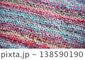 Close-up Texture of Handmade Knitted Clothing with Colorful Yarn Patterns 138590190