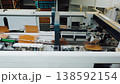 Automated packaging workflow. Robotic systems for factories. Manufacturing line utilizing robotic folding and sealing. Production process featuring conveyor automation and robotic handling 138592154