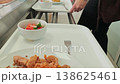Self-service cafeteria line with fresh vegetable salad 138625461