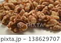 A close-up video of walnuts; macro footage of nuts against a white background. 138629707