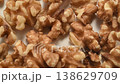 A close-up video of walnuts; macro footage of nuts against a white background. 138629709
