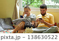Detached couple absorbed in smartphones on living room couch 138630522