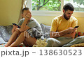 Detached couple absorbed in smartphones on living room couch 138630523