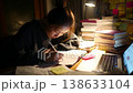 A woman studying 138633104