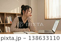 A woman studying 138633110