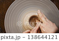 Making pottery on a wheel in a studio setting 138644121