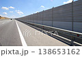 Soundproof fencing along the expressway. Hyperlapse. Shooting in motion. A barrier near an asphalt road. Highway. The highway. 138653162