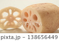 A cross-section of a fresh lotus root cut horizontally. 138656449