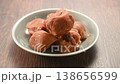 Close-up video of pickled plums served on a white plate 138656599