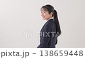 A woman in a suit that makes a guts pose A woman in a suit that makes a guts pose 138659448