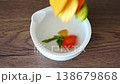 Vegetable chips falling into empty bowl top view. Healthy snack preparation and clean eating concept. 138679868