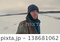 Man Spinning on Snowy Field in Winter Weather 138681062