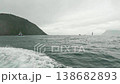 A view from a motorboat in the open Pacific Ocean during cloudy, choppy weather. Waves splash from below in all directions 138682893