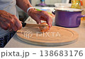 Woman cutting and preparing vegetables at home in the kitchen. Concept for cooking and food preparation. 138683176