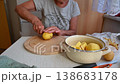 Woman cutting and preparing vegetables at home in the kitchen. Concept for cooking and food preparation. 138683178