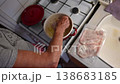 Woman cutting and preparing vegetables at home in the kitchen. Concept for cooking and food preparation. 138683185