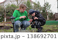 Siblings exploring nature together in a spring garden 138692701