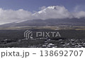 A time-lapse video (panning) of the snow-covered town and Mt. Fuji as seen from a hilltop in Yamanakako Village. 138692707