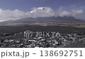 A time-lapse video (zoomed in) of the snow-covered town and Mt. Fuji as seen from a hilltop in Yamanakako Village. 138692751