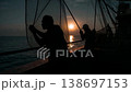 A dramatic morning as Japanese fishermen powerfully pull their nets into the sea against the backlight. 138697153