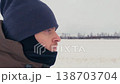 Winter Trek: Adventurous Run Across Snowy Fields 138703704