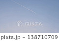 Airplane contrail against a clear blue sky. 138710709