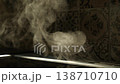 Steam rises from oven in cozy kitchen. 138710710