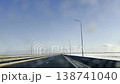 Driving a passenger car on a high-speed road on a sunny winter day. 138741040