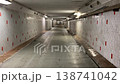 Walking through an empty, scary old tunnel. 138741042