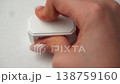 Rubber stamp prints entered text in red ink over empty white document during entry verification. 138759160