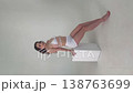 Confident Model Posing in a White Studio 138763699