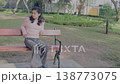 Young Girl on Rollerblades Waiting on Bench and Standing Up 138773075