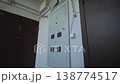 Electrical box stays positioned between private apartments 138774517