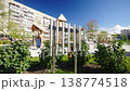 Courtyard with playground surrounded by high-rise buildings 138774518