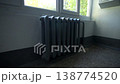 Vintage heater remains positioned beside letter units 138774520