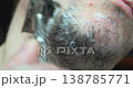 Personal hygiene routine: shaving a man's face with a vintage-style razor. 138785771