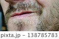 Male Preparing for Shave: Detailed Facial Hair Inspection 138785783
