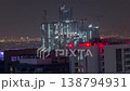 Heavy cranes building new towers in Dubai aerial night time-lapse 138794931
