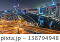 Glowing skyscrapers and canal in Dubai Business Bay all night time-lapse 138794948