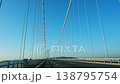 Akashi Kaikyo Bridge on a clear day, front view from a moving car window. 138795754