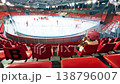 Little girl watching ice hockey training in indoor arena stands 138796007