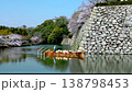 Enjoy the cherry blossoms in full bloom from a traditional Japanese boat on the inner moat of Himeji Castle. 138798453