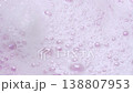 Slow motion close-up soap foam texture on pink background, white shampoo soapsud 138807953