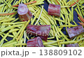 Close-up of sliced yellow carrots with raw marrow bones in empty kazan for Uzbek plov 138809102