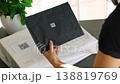 Person scanning QR code on parcel with smartphone camera with focus on mobile device screen. Digital app interface and contactless delivery service concept. 138819769