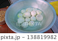 Close-up of aluminum bowl with peeled white onions soaking in water for pilaf 138819982