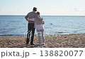 Senior mature couple hugging enjoying outdoor recreation walking on beach. Old husband wife embracing with tenderness love enjoying sweet bonding. Grandmother grandfather together. Family moment love 138820077