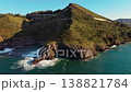 Aerial drone view of Cantabrian coastline with cliffs, green hills and ocean waves. Scenic coastal 138821784