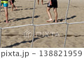 Young men playing beach volleyball on sunny day Young men playing beach volleyball on sunny day 138821959